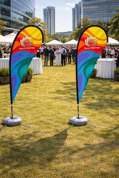Custom Printed Double Sided Teardrop Flag with Cross Base & Water Weight Bag – Premium Satin Fabric Advertising Flag | 2 Printed Fabrics Stitched Together for Double Side View | Indoor & Outdoor Promotional Display | Yalla Printing UAE