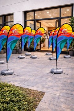Custom Printed Double Sided Teardrop Flag with Cross Base & Water Weight Bag – Premium Satin Fabric Advertising Flag | 2 Printed Fabrics Stitched Together for Double Side View | Indoor & Outdoor Promotional Display | Yalla Printing UAE