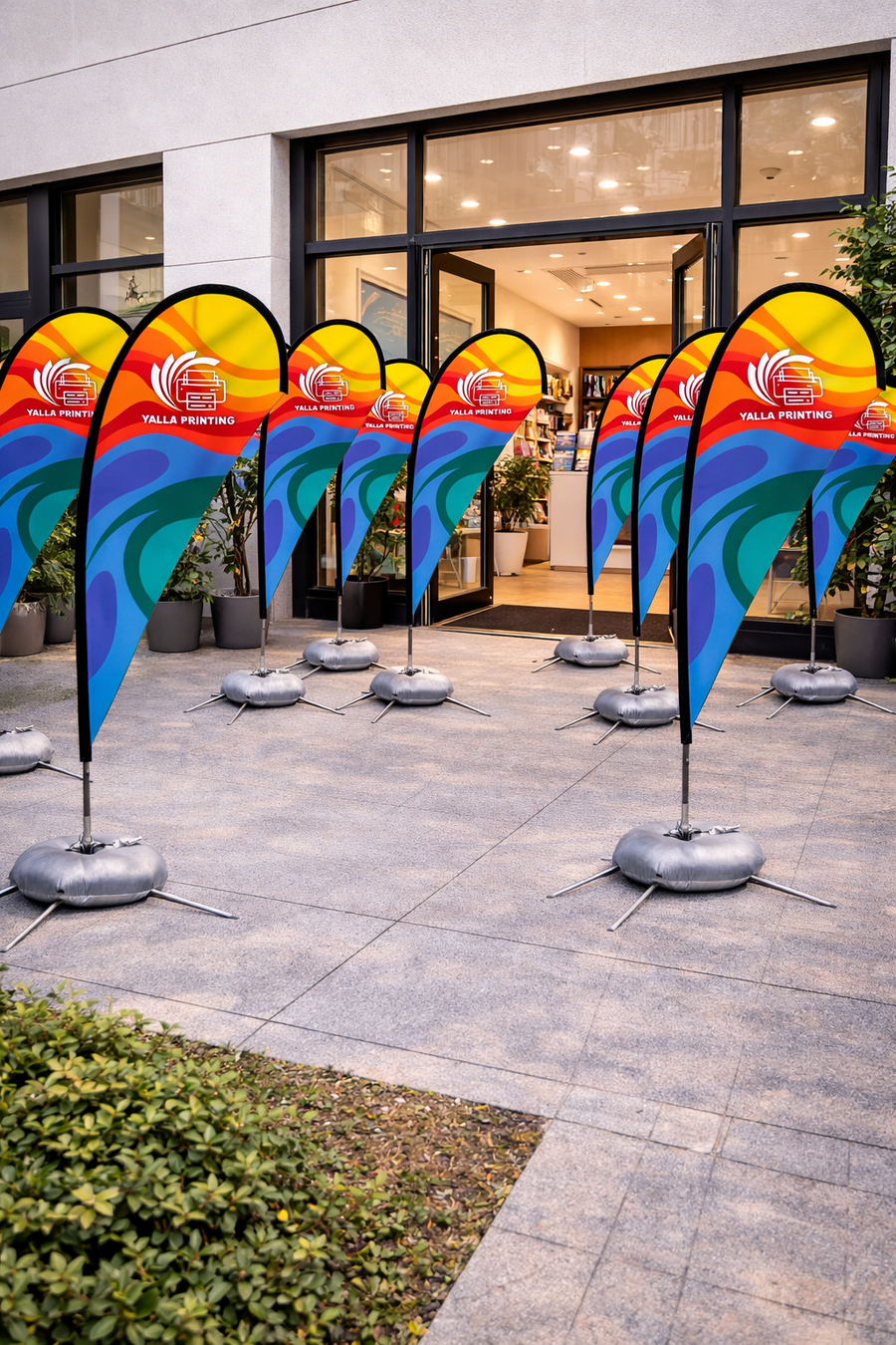 Custom Printed Double Sided Teardrop Flag with Cross Base – Premium Satin Fabric Advertising Flag | 2 Printed Fabrics Stitched Together for Double Side View | Indoor & Outdoor Promotional Display | Yalla Printing UAE