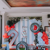 Racing-Themed Birthday Party Decor Set - 4 Cutouts: Backdrop Panel, Large Road Number, and Two Tire Props