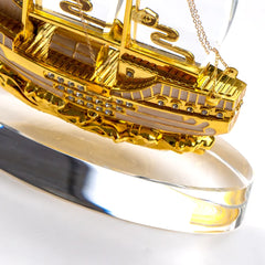 Golden Boat-Shaped Memento in Metal with Glass Base