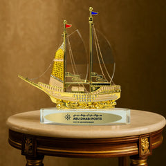 Golden Boat-Shaped Memento in Metal with Glass Base